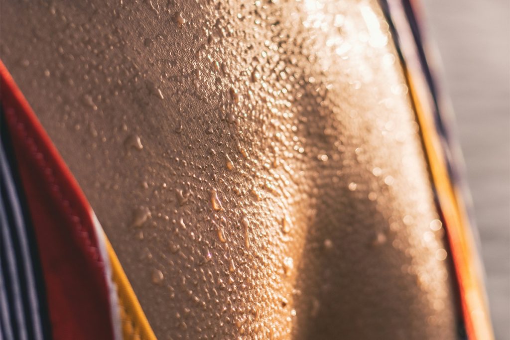close up of chest skin with goosebumps and sweat